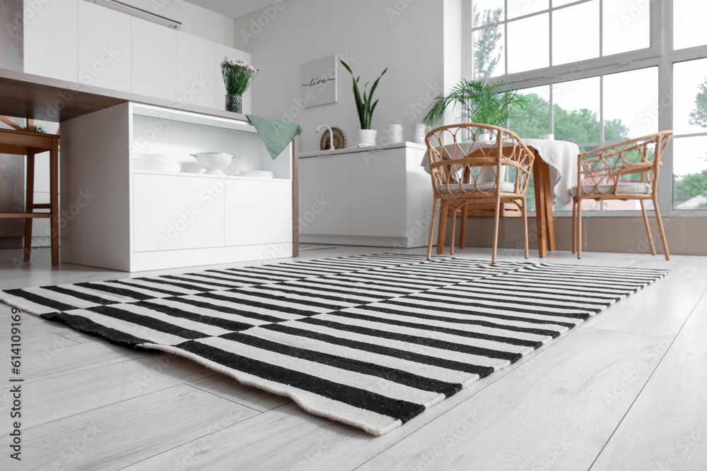 Stylish striped carpet in interior of modern kitchen