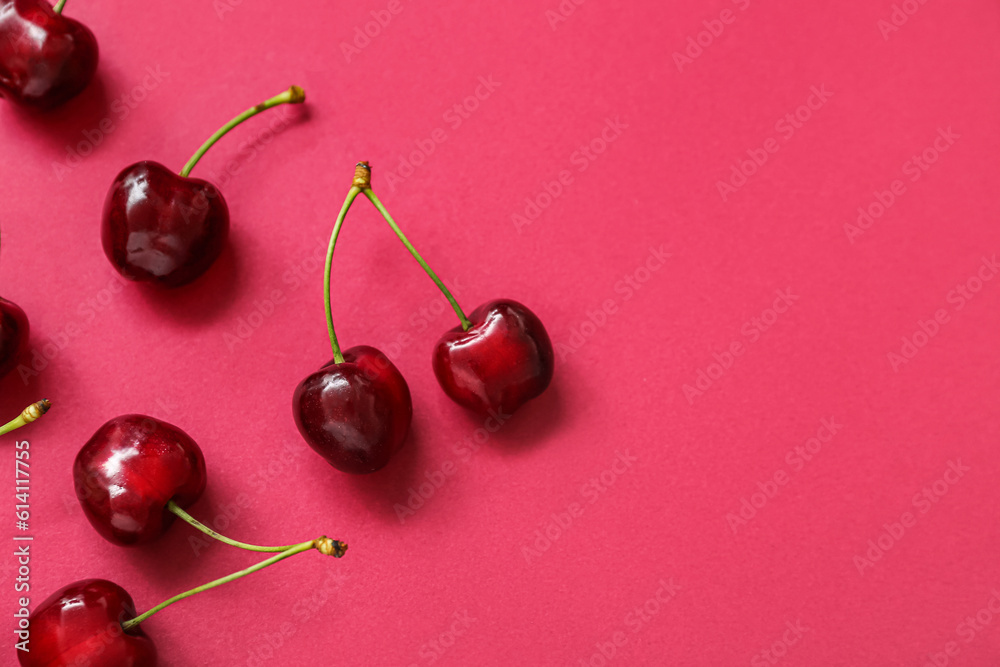 Many sweet cherries on red background