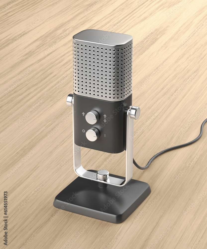 Modern studio microphone on wooden desk