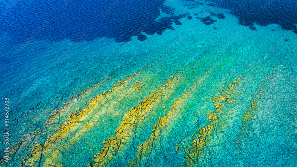 View from the air on the waves and rocks. Sea relaxation and travel. Azure water on the sea. A brigh