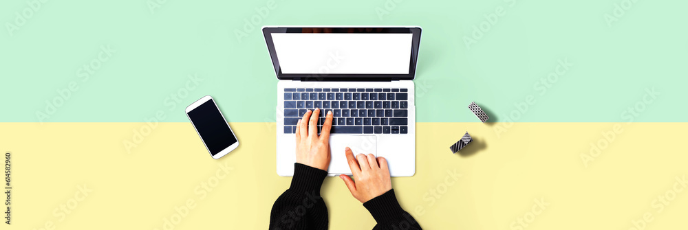 Person using a laptop computer from above