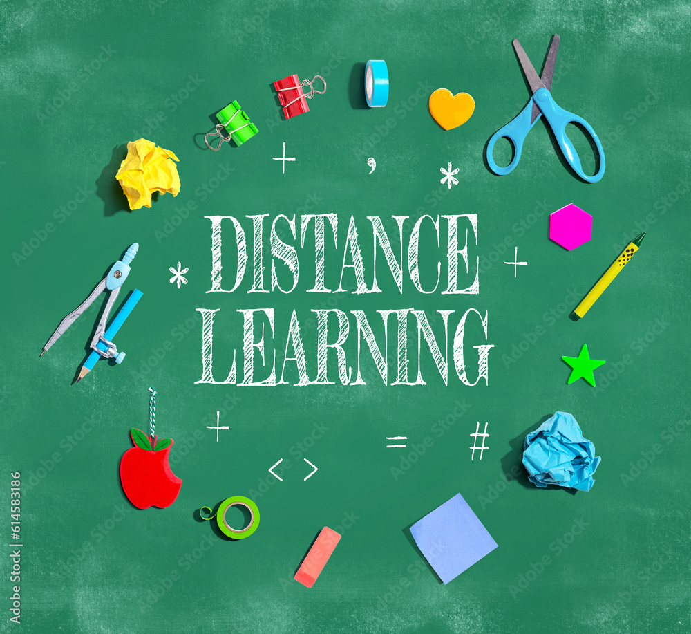 Distance Learning theme with school supplies on a chalkboard - flat lay