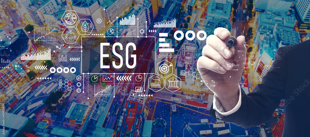 ESG - Environmental, Social and Governance concept with businessman in a city at night