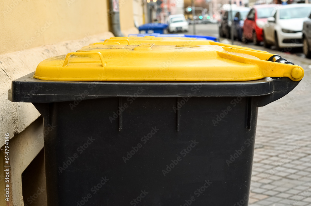 Garbage container on city street, closeup