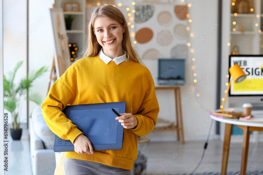 Female graphic designer with tablet in office