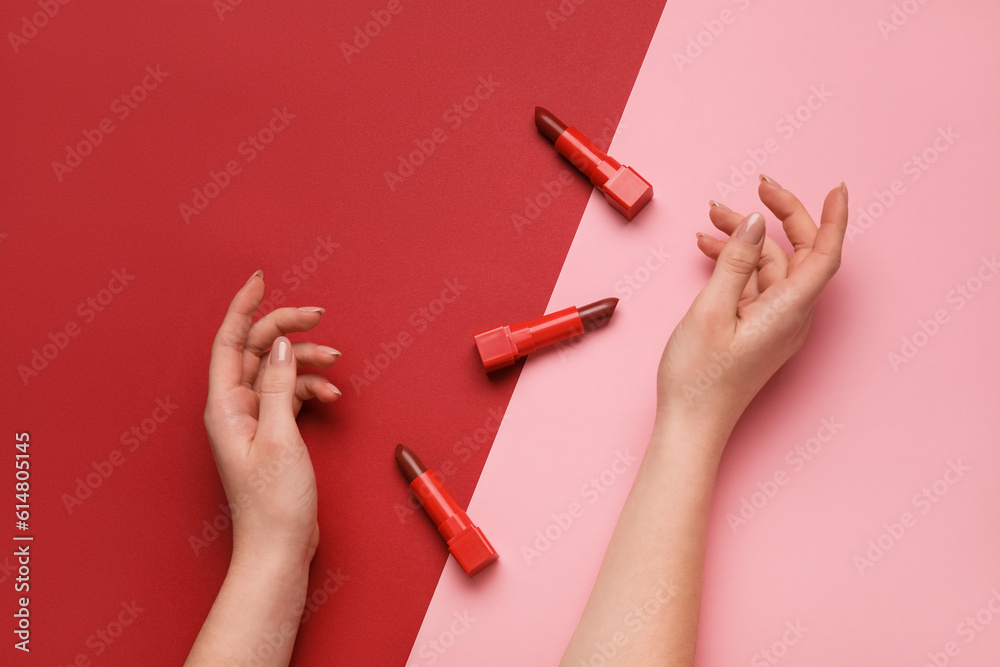 Woman with lipsticks on color background