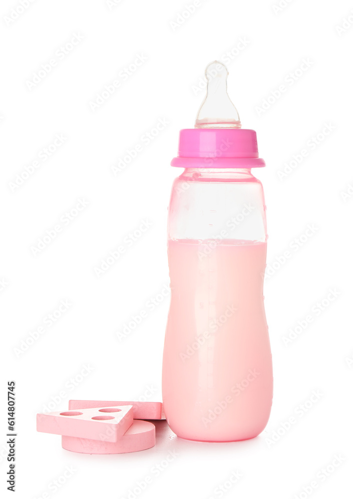 Bottle of milk for baby with toys isolated on white background