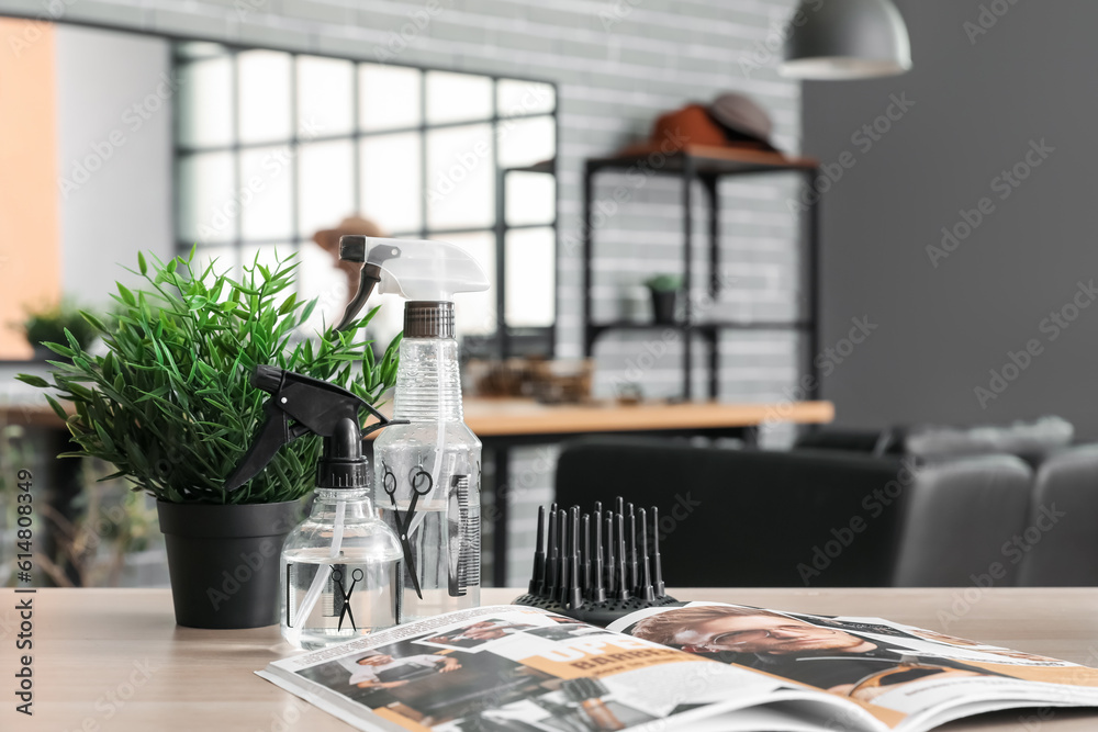 Different hairdressing tools on table in beauty salon