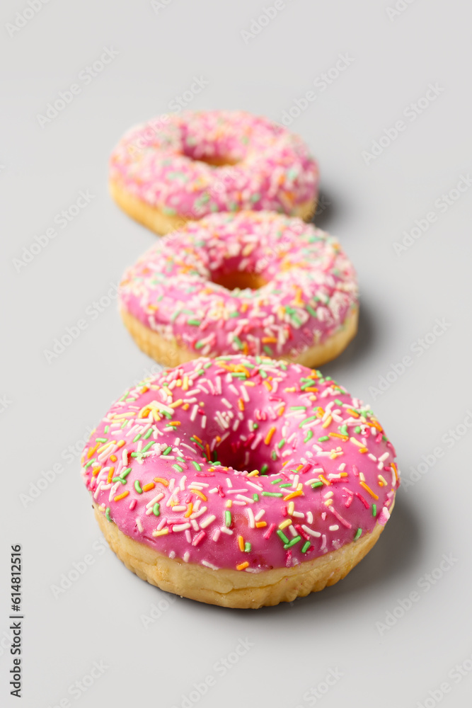 Sweet donuts on grey background