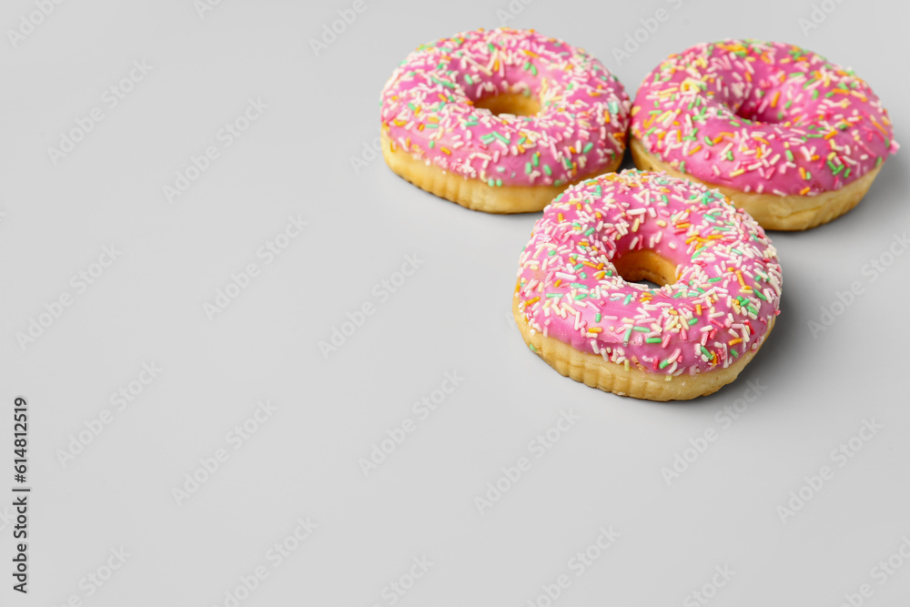 Sweet donuts on grey background