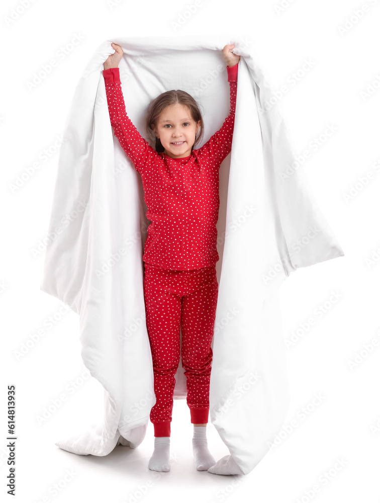 Little girl in pajamas with soft blanket on white background