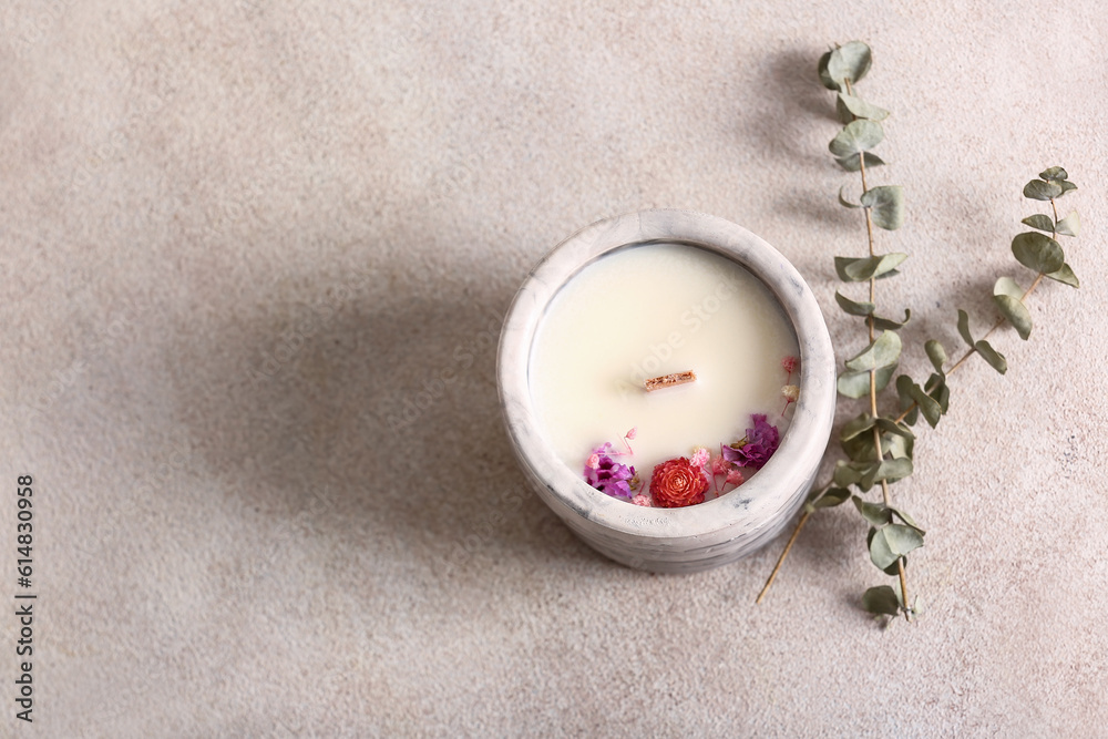 Holder with candle and eucalyptus on white background