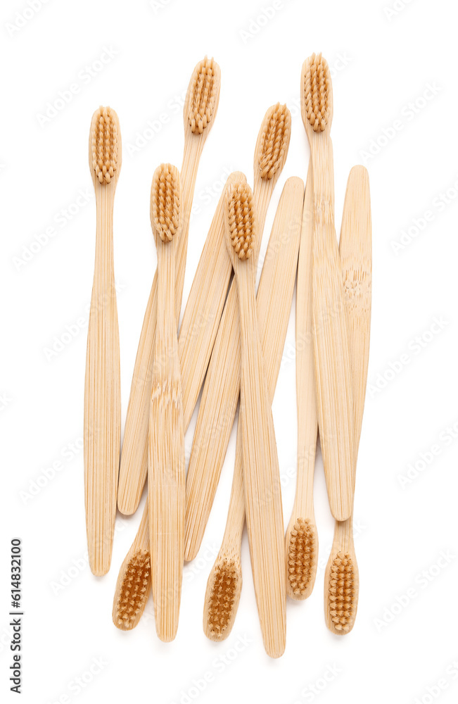 Many bamboo toothbrushes on white background