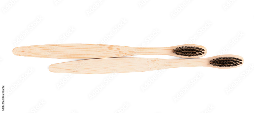 Bamboo toothbrushes on white background