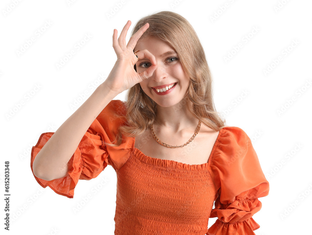 Young woman showing OK on white background