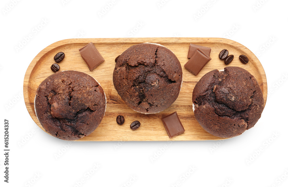 Wooden board with tasty chocolate cupcakes isolated on white background