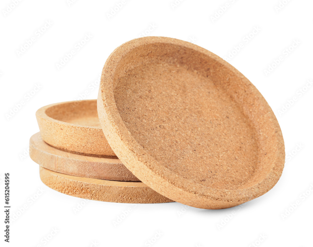 Wooden kitchen boards and cork plates on white background