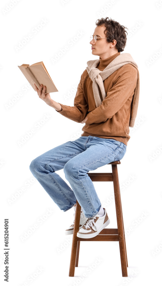 Young man reading book on white background