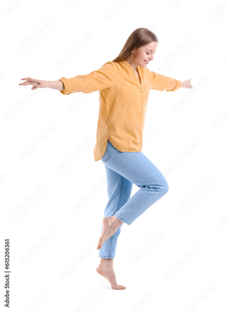 Young woman balancing on white background