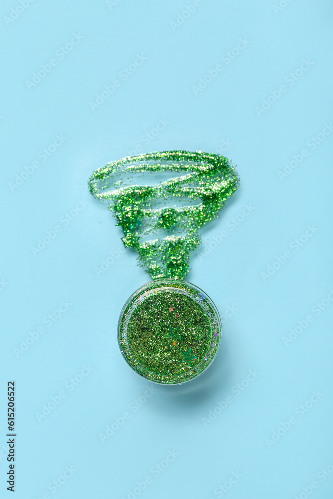 Jar of glitter with stroke on blue background