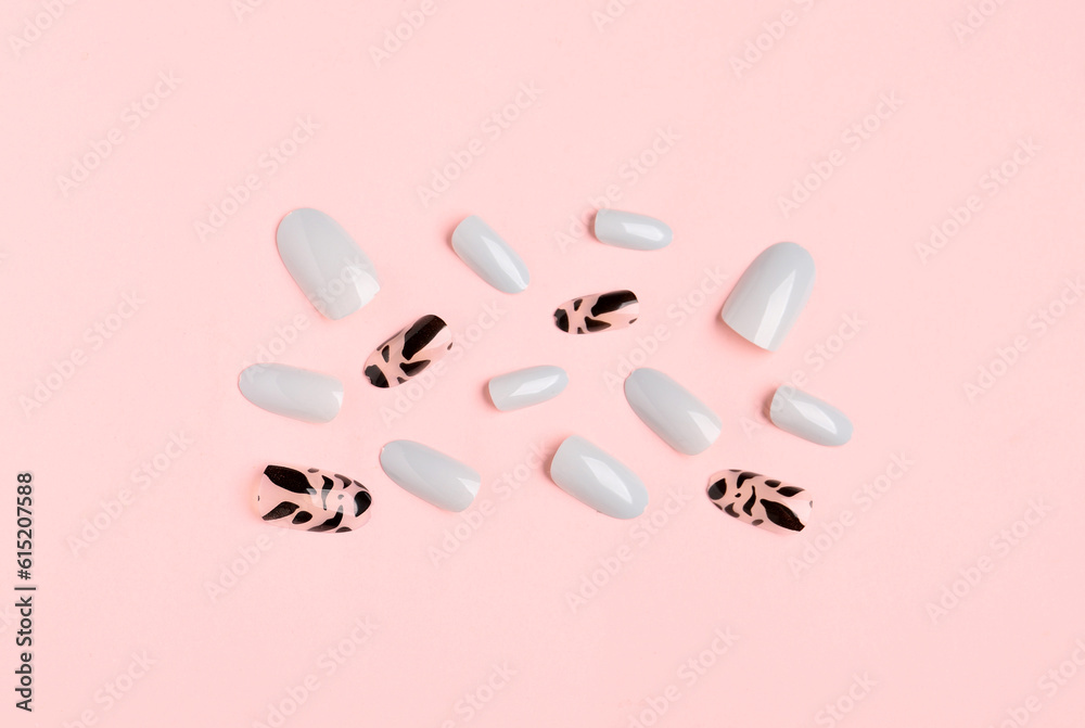 Press-on nails on pink background