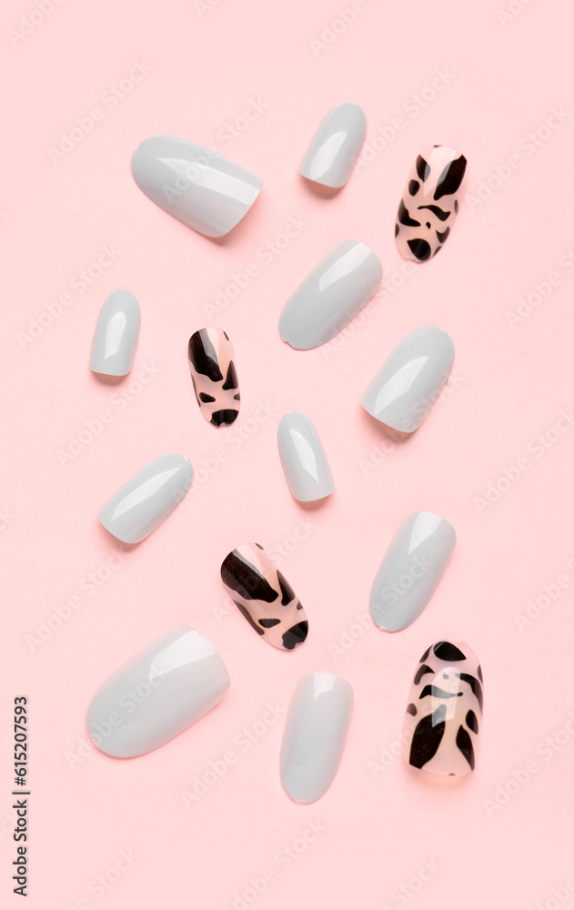 Press-on nails on pink background