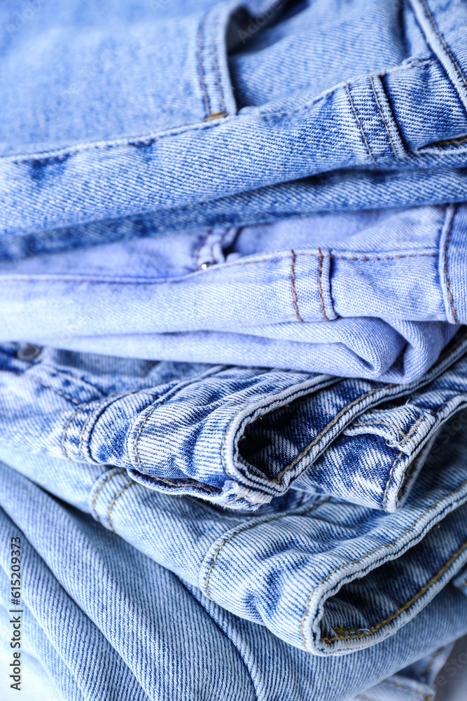 Folded jeans as background, closeup