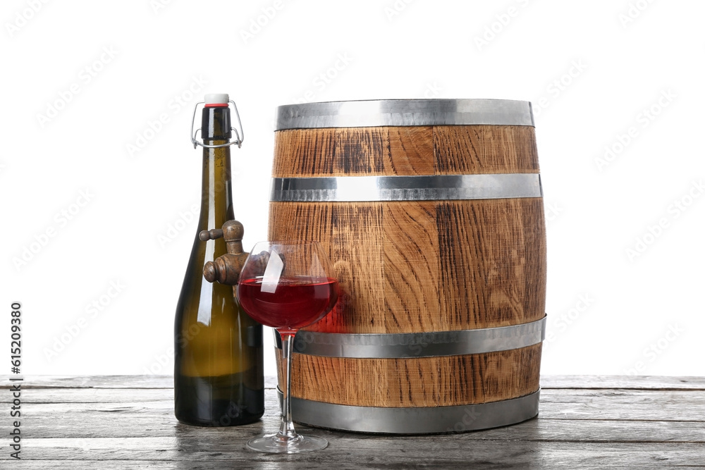 Wooden barrel with bottle and glass of wine on table against white background