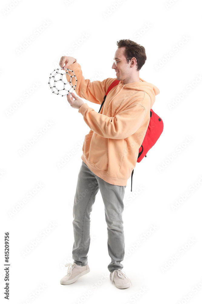 Male student with model of molecule on white background