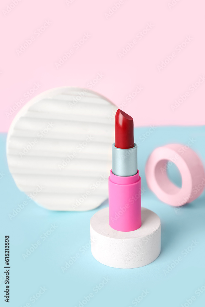 Decorative plaster podiums and lipstick on color background