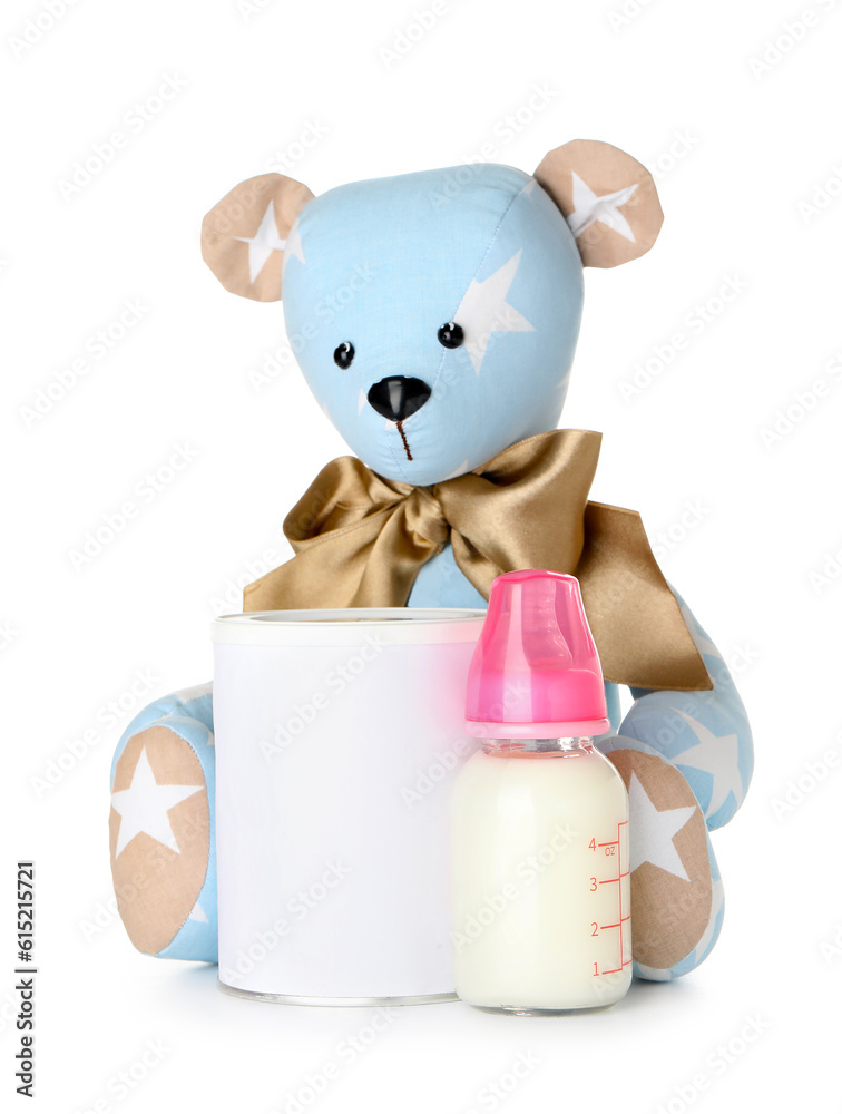 Teddy bear with bottle of milk for baby isolated on white background