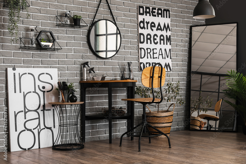 Interior of modern beauty salon with mirrors and table