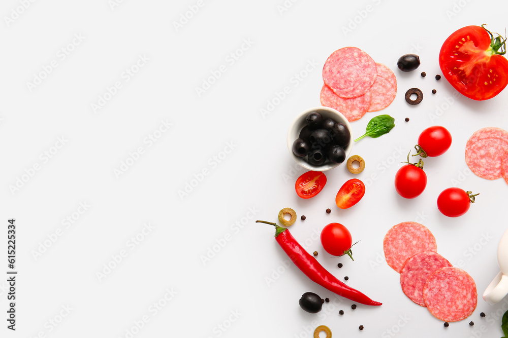 Fresh ingredients for preparing pizza on white background