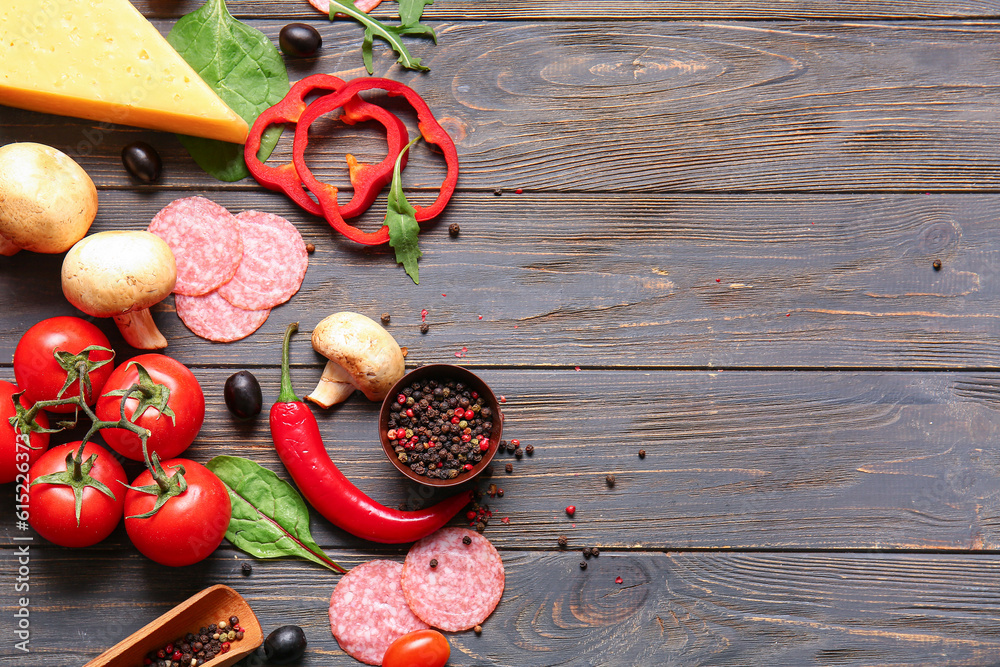 Different ingredients for preparing pizza on wooden background