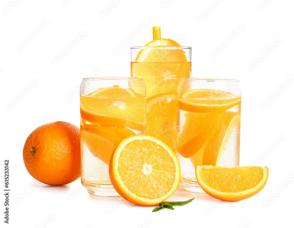 Glasses of infused water with orange slices on white background