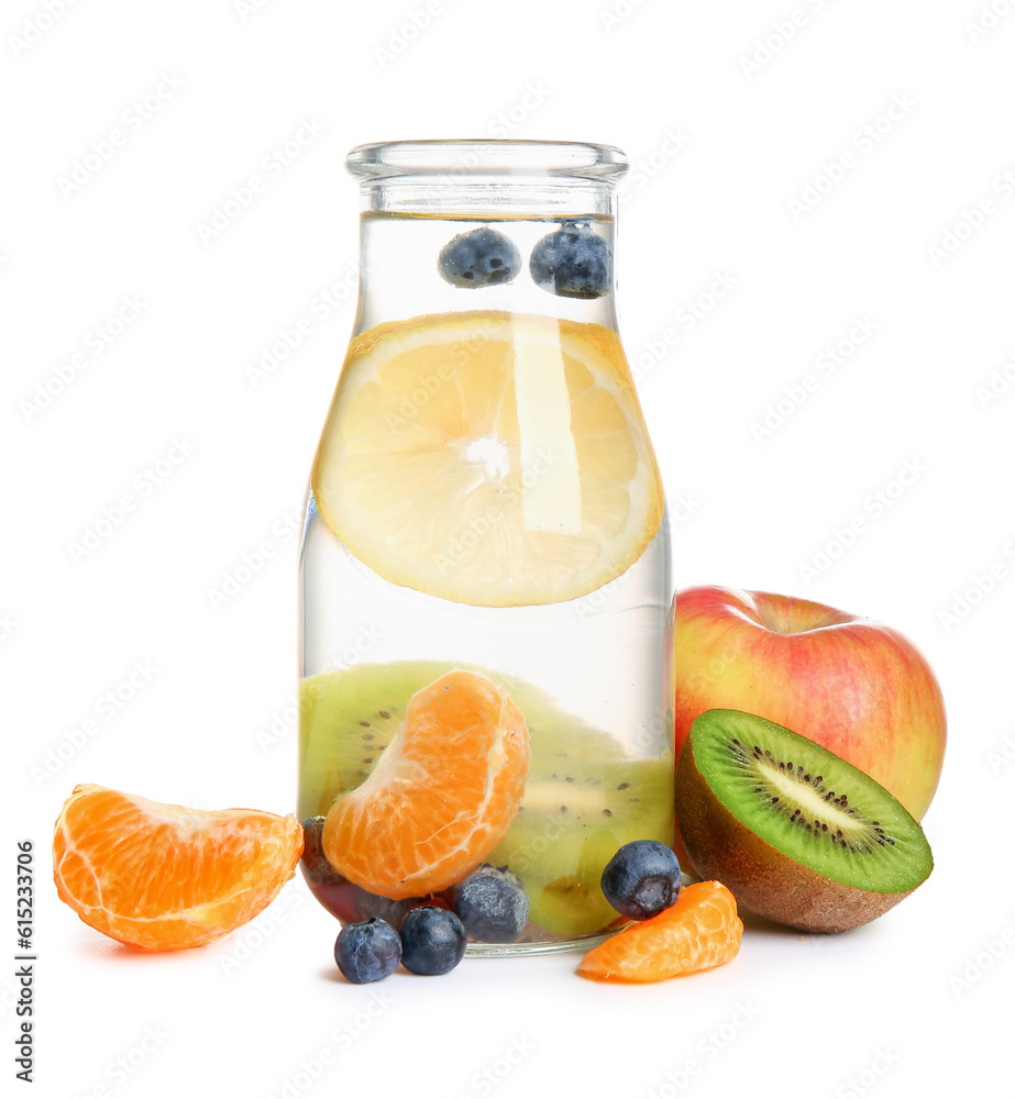 Bottle of infused water with different sliced fruits on white background