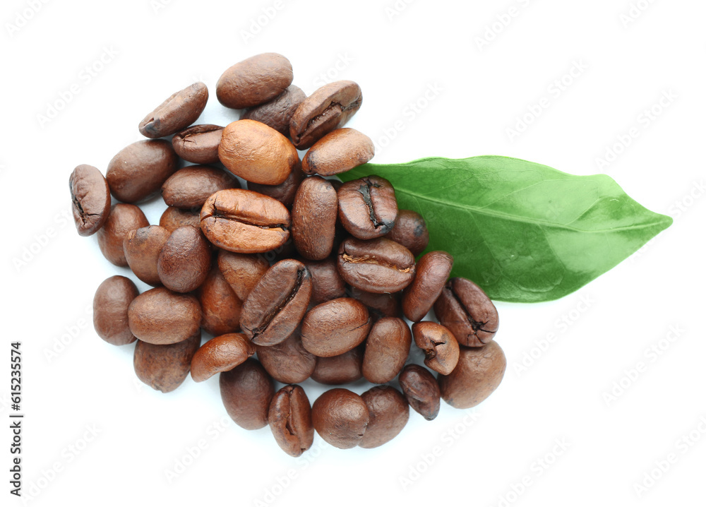 Heap of coffee beans and leaf on white background