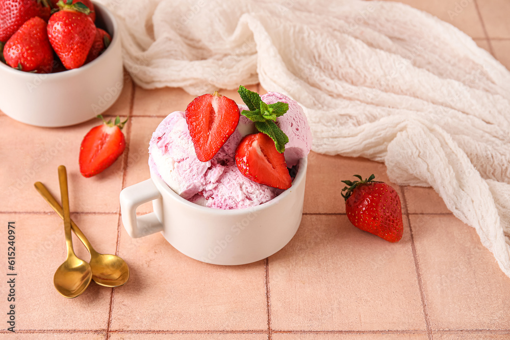 Cup with delicious ice cream, fresh strawberries and mint on pink table