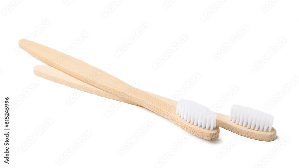 Bamboo toothbrushes on white background