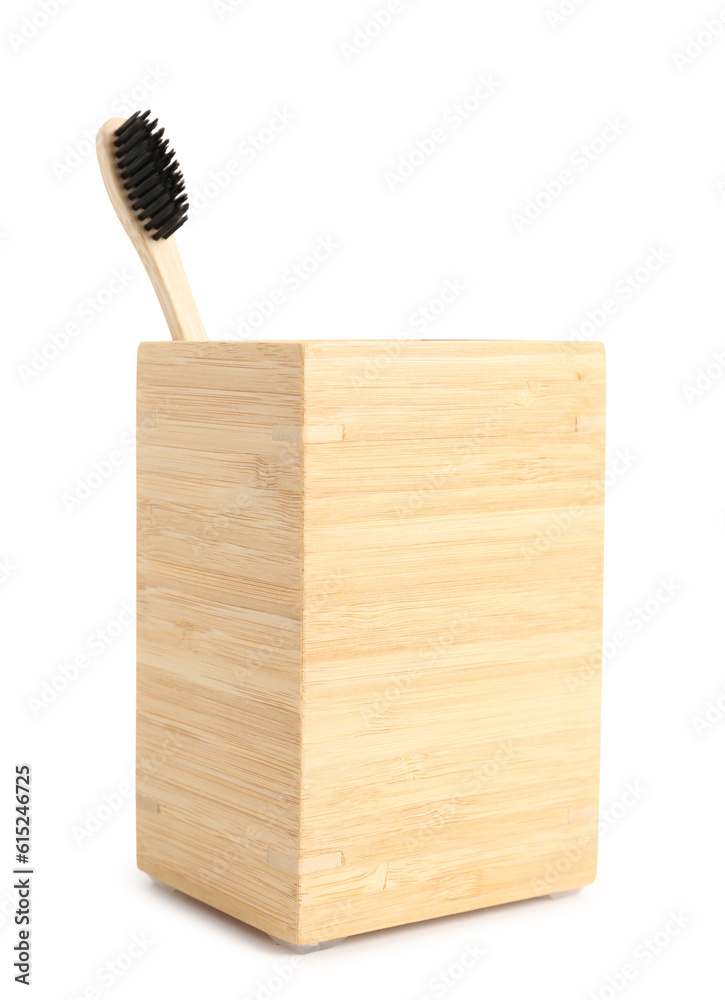 Bamboo tooth brush in holder on white background