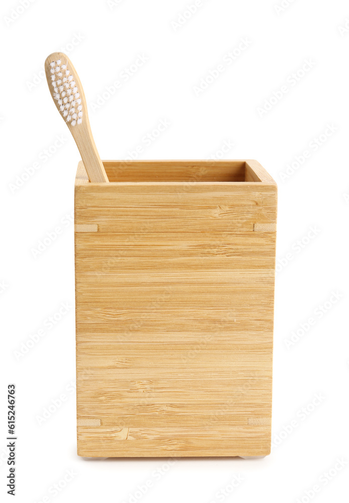 Bamboo tooth brush in holder on white background