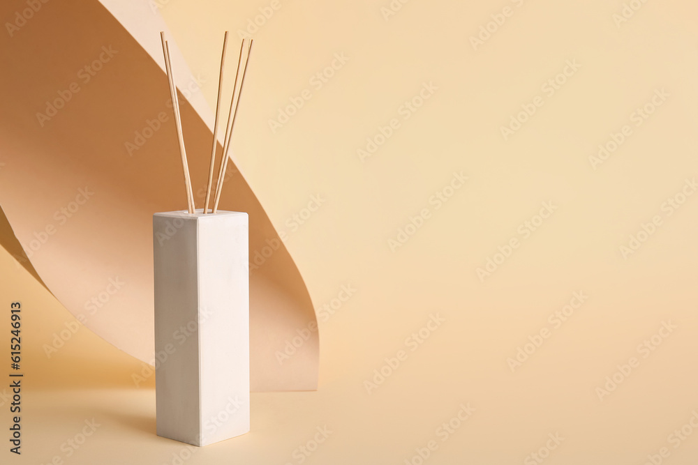 Reed diffuser on beige background