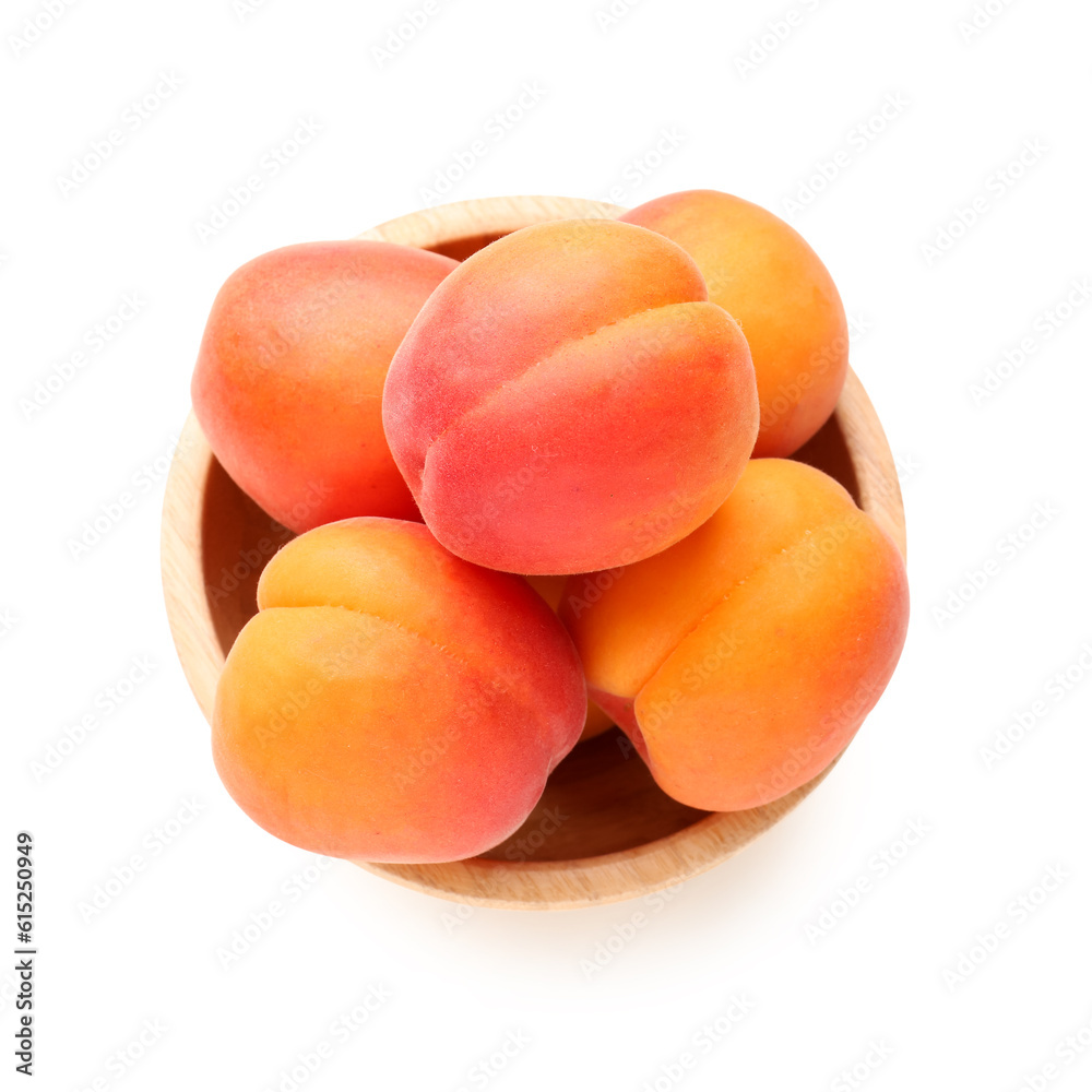 Bowl with ripe apricots isolated on white background