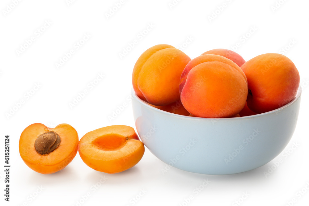 Bowl with ripe apricots isolated on white background