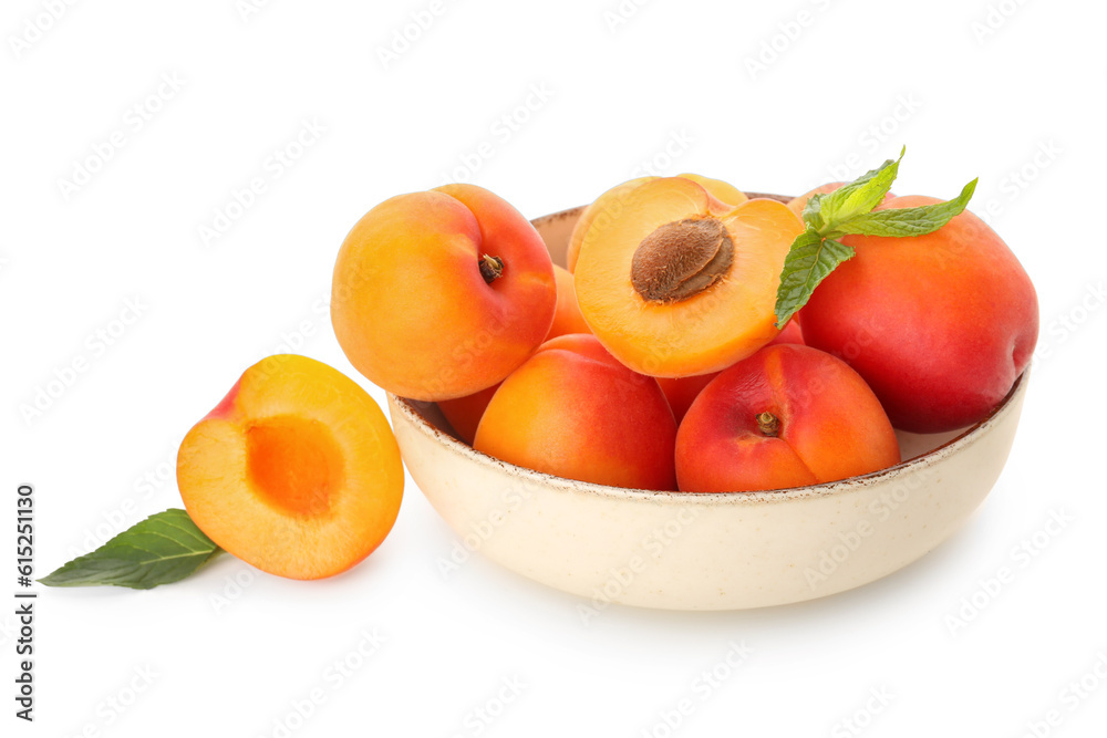 Bowl with ripe apricots isolated on white background