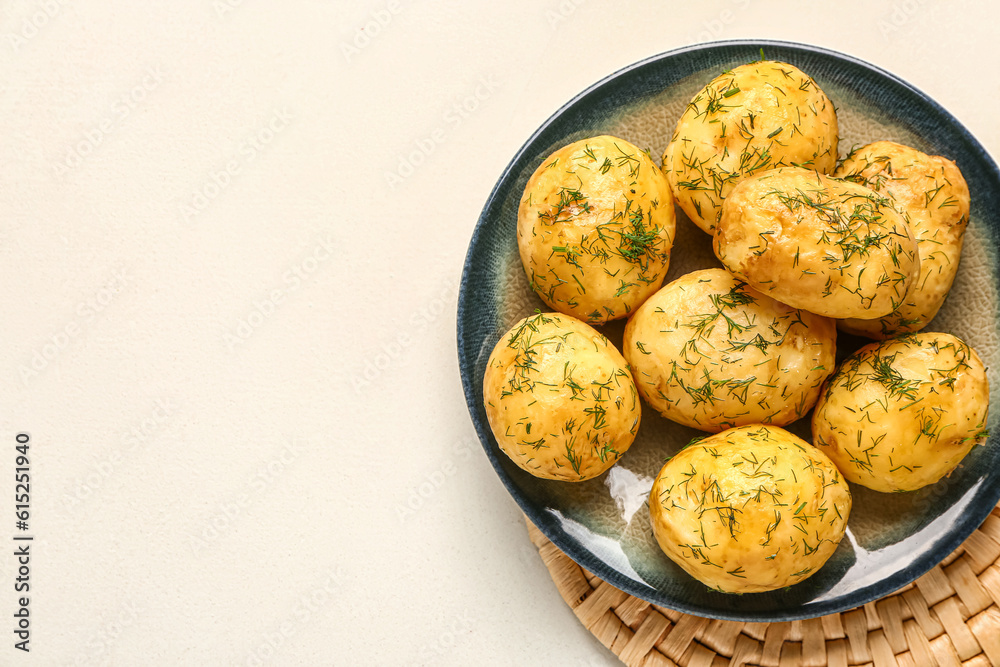 Plate of boiled baby potatoes with dill on white background