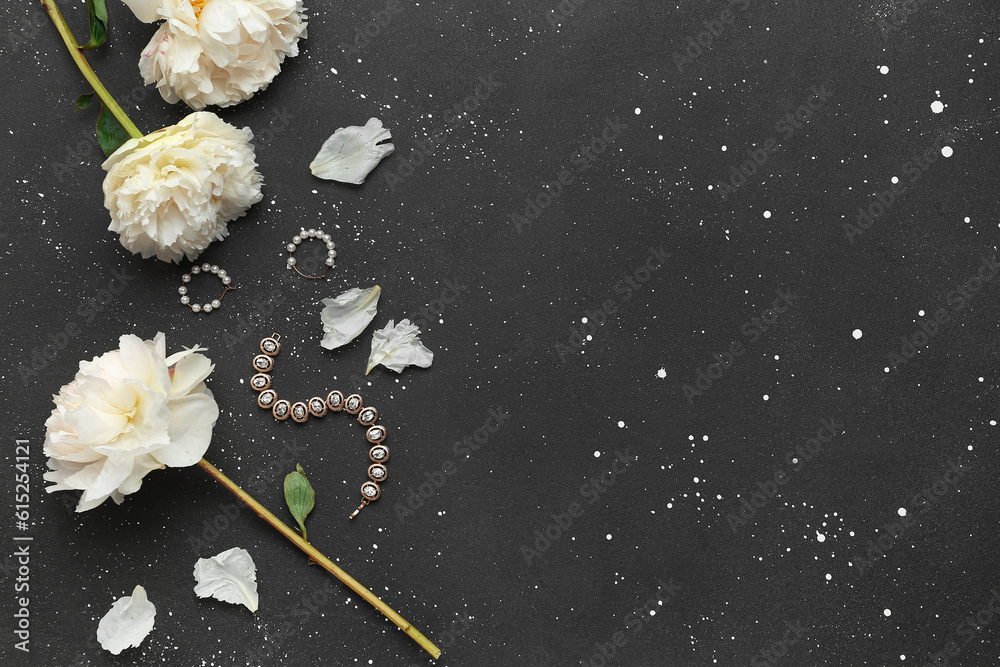 Composition with stylish female accessories and beautiful peony flowers on dark background