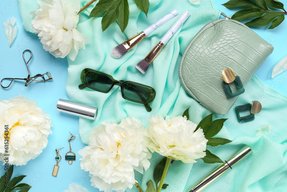 Composition with stylish female accessories, cosmetics and beautiful peony flowers on color backgrou