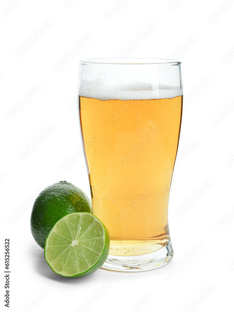 Glass of cold beer with lime on white background