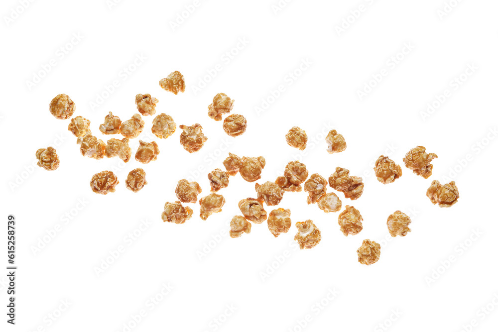 Flying tasty caramel popcorn on white background